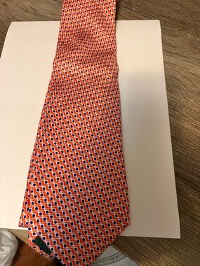 Men’s Ralph Lauren Orange and Blue Patterned neck tie.